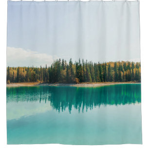 GREEN TREES BESIDE BODY OF WATER DURING DAYTIME