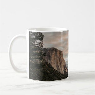 GREEN TREES NEAR BROWN MOUNTAIN UNDER CLOUDY SKY D COFFEE MUG