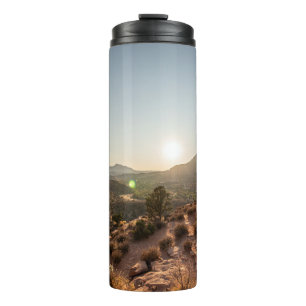 GREEN TREES ON BROWN MOUNTAIN DURING DAYTIME THERMAL TUMBLER