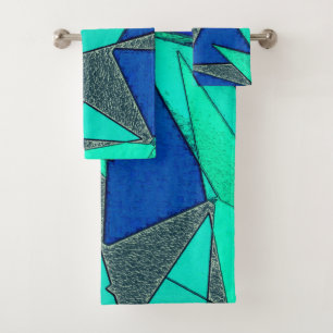 Green triangular cutouts on blue background, rough bath towel set