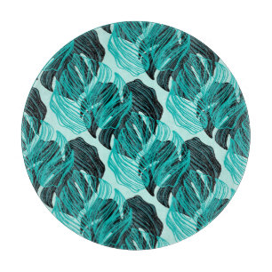 Green tropical palm leaves design. cutting board