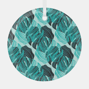 Green tropical palm leaves design. glass ornament