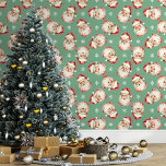 Green Vintage Santa Claus Christmas Wallpaper<br><div class="desc">Bring the magic of the holidays into your home with this green vintage Santa Claus Christmas wallpaper. Featuring charming illustrations of Santa's cheerful face and delicate snowflakes against a green background, this design adds a festive and nostalgic touch to any room. Perfect for creating a cozy and merry atmosphere, this...</div>