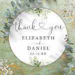 Greenery Heart Script Thank You Wedding Favour Classic Round Sticker<br><div class="desc">Elegant greenery floral heart script thank you sticker personalized with your names and special date. Designed by Thisisnotme©</div>