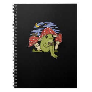 Grenouille fan de livre avec chapeau de champignon