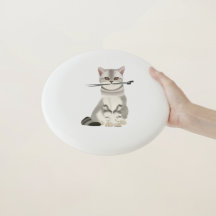 Grey and White Cat holding Knitting Needles