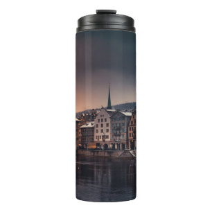 GREY AND WHITE CONCRETE BUILDING NEAR BODY OF WATE THERMAL TUMBLER