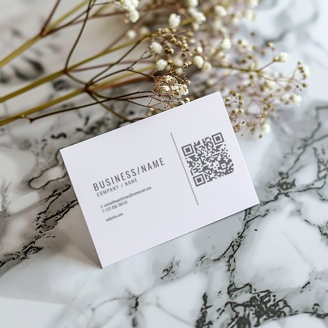 Grey and white QR code business card (Minimalist white business card with grey text and QR code for instant contact.)