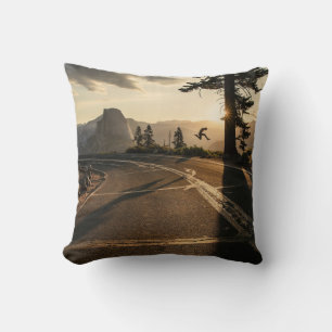 Grey asphalt road near mountain in the morning throw pillow
