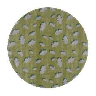 Grey autumn leaves pattern on a green background cutting board