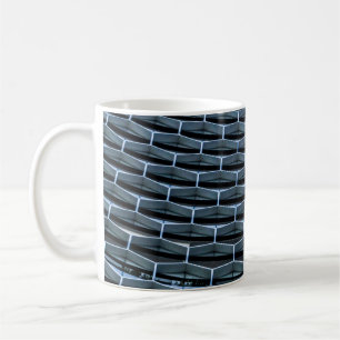 Grey building under clear blue sky coffee mug