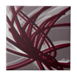 Grey & Burgundy Abstract Ribbons Tile<br><div class="desc">Modern artistic design featuring burgundy wine coloured ribbons with white accents on a grey background. Designed with vector graphics, you can create your own customized throw pillow by changing the background and border colours. To create your personalized design, select “customize” and navigate to the layers section to view the images...</div>