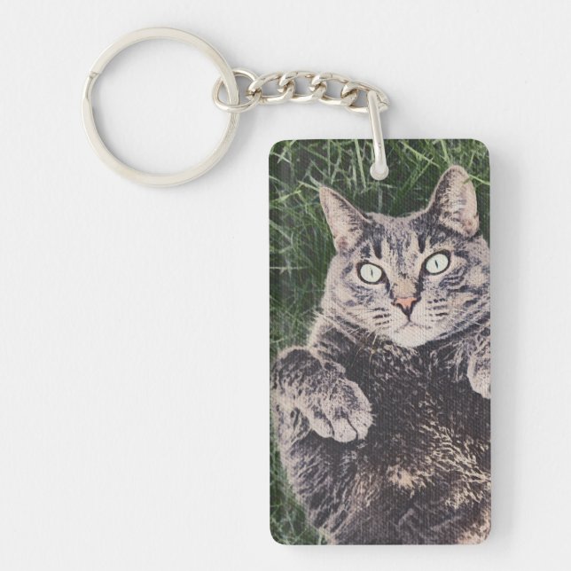 grey cat lying in the grass Acrylic Keychain (Front)