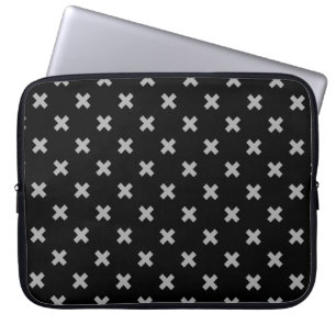 Grey cross stitches on black laptop sleeve