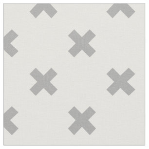 Grey cross stitches on white fabric
