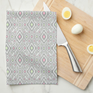 Grey, green, pink rhombuses on a white kitchen towel
