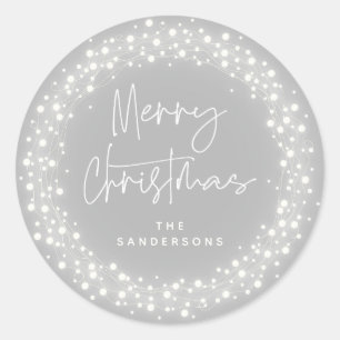 Grey Merry Christmas Script Sparkling Lights Classic Round Sticker