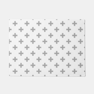 Grey polka crosses on white doormat