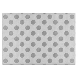 Grey polka dots on white cutting board