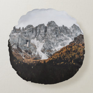 GREY ROCKY MOUNTAIN WITH TREES BELOW DAYTIME ROUND PILLOW