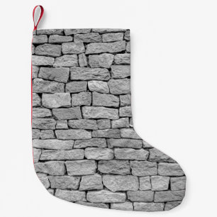 Grey stone wall, abstract background. small christmas stocking