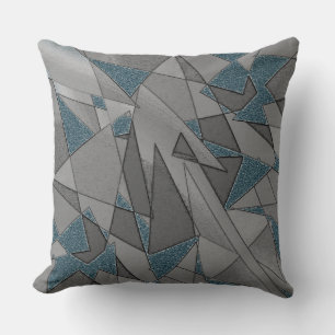 Grey triangular cutouts on blue background, rough throw pillow