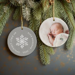 Grey Winter Snowflake First Christmas Keepsake Ceramic Ornament<br><div class="desc">Ceramic holiday ornament personalized with your baby's photo and custom "My First Christmas" text. This simple modern holiday design features a white snowflake on a grey background. Use the design tools to choose any background colour, edit text fonts and colours and add your own photos to create your own unique...</div>