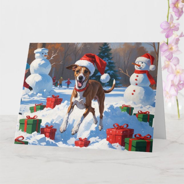 Greyhound Running in Snow with Christmas Hat Card (Orchid)