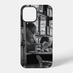 GREYSCALE PHOTO OF MAN SITTING WHILE READING NEWSP iPhone 12 CASE