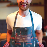 Grill Master Green Sausage Grilling Fork Name Apron<br><div class="desc">This cool and modern pattern is perfect for the grilling master. It features a hand-drawn brown, tan, silver, black, and dark gold sausage with a grill fork cartoon illustration pattern on top of a forest hunter green abstract pattern. This design also features the phrase, "Grill Master, " with a monogram...</div>