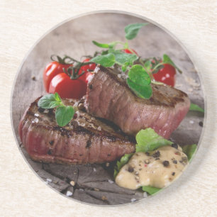 Grilled bbq steaks with fresh herbs and tomatoes coaster