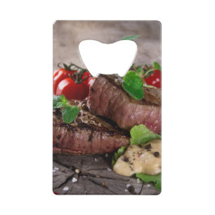 Grilled bbq steaks with fresh herbs and tomatoes wallet bottle opener