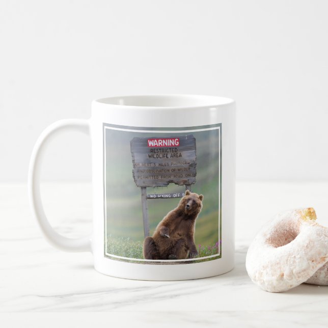 Grizzly Bear Plays With Sign Coffee Mug (With Donut)