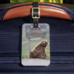 Grizzly Bear Plays With Sign Luggage Tag<br><div class="desc">Grizzly bear scratches a roadside sign in Sable Pass,  Denali National Park,  Alaska</div>