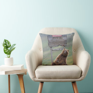 Grizzly Bear Plays With Sign Throw Pillow