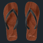 Groom Wedding Day Rustic Wood Look Beach Honeymoon Flip Flops<br><div class="desc">Rustic wood look groom thong sandals flip flops perfect for beach weddings- Reads Groom in elegant, pastel lettering at the bottom. Elegant, rich mahogany woodgrain pattern look background. Note: Wood is printed image. Rustic wedding favours for bridal party members. Just change text templates to create your own personalized wedding party...</div>