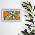 Groovy 60s 70s Hippie Flower Orange Retro Daisy Business Card Holder<br><div class="desc">This orange, retro design boasts a kaleidoscope of warm, earthy tones that epitomize the essence of the ‘60s and ‘70s, inviting you to the world that’s nothing short of groovy. It features a hypnotic, flower-inspired motif that radiates outward in a dazzling display of oranges, yellows, and greens, turquoises reminiscent of...</div>