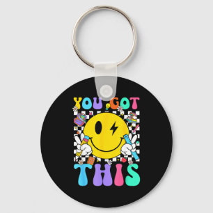 Groovy got this smile face testing day teacher keychain