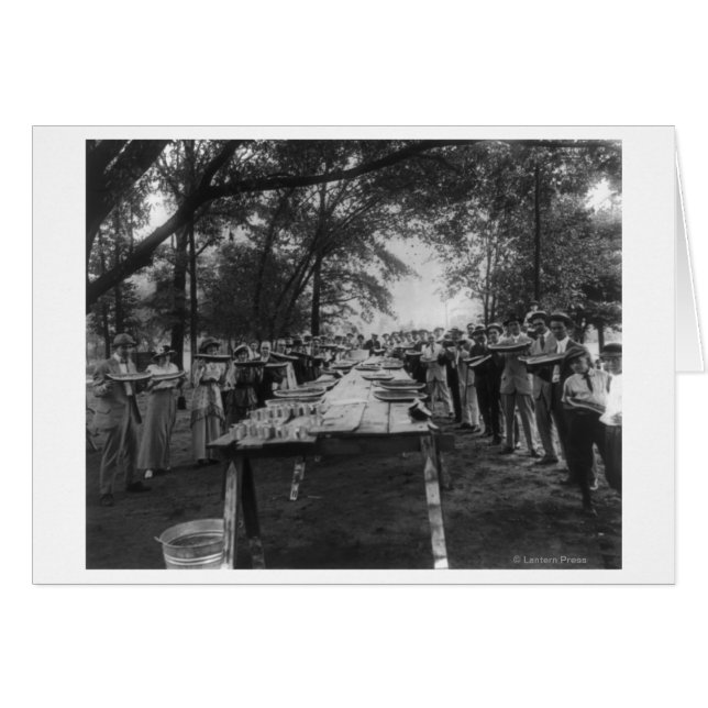 Group Eating Large Pieces of Watermelon (Front Horizontal)