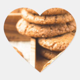 Group of oatmeal cookies on the wooden tray heart sticker