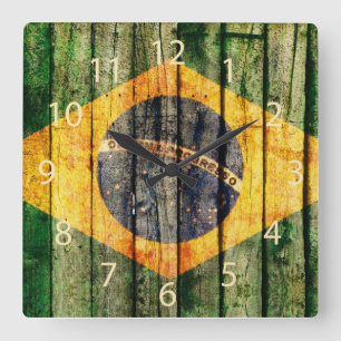 Grunge Brazilian flag on rustic wood background Square Wall Clock