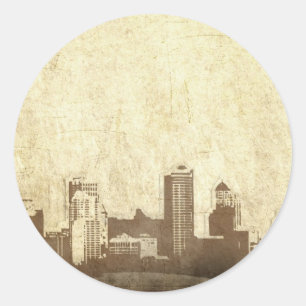 Grungy city background classic round sticker