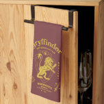 GRYFFINDOR™ Determination Courage Bravery Crest Kitchen Towel<br><div class="desc">Show your house pride with this bold Gryffindor™ crest design, celebrating the values that define the bravest of witches and wizards. Featuring the iconic lion standing proudly before a shield, this striking artwork highlights Gryffindor’s core traits — Courage, Determination, and Bravery — in a powerful, vintage-inspired layout. The rich house...</div>