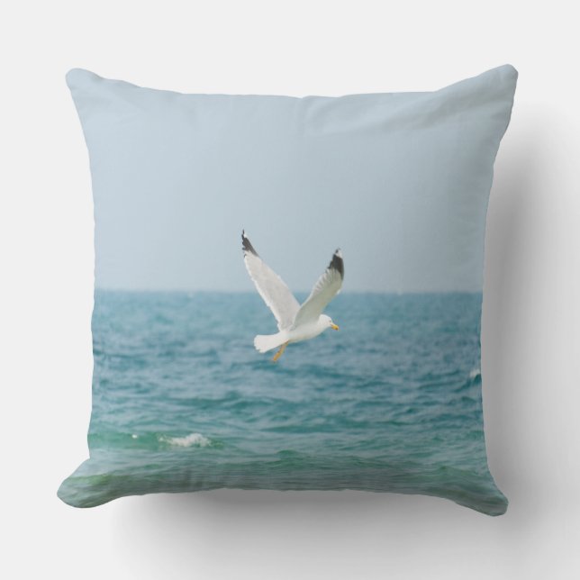 Gull flying above sea throw pillow (Front)