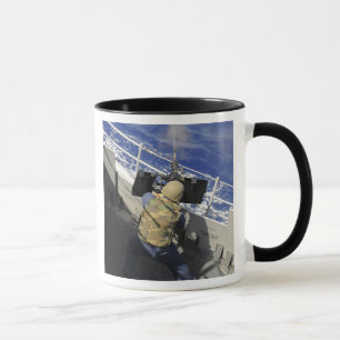 Gunners Mate firing a 50 calibre machine gun Mug