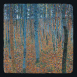 Gustav Klimt Beech Tree Forest Grove Trivet<br><div class="desc">This is based on classic nature painting artworks by Gustav Klimt, Beech Grove 1, 1902. The artwork portrays a dense forest of tall, slender birch trees, with pale trunks marked by dark, vertical lines. The foliage is depicted in shades of blue, green, and yellow, adding a sense of depth and...</div>