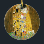 Gustav Klimt The Kiss Vintage Art Nouveau Painting Ceramic Ornament<br><div class="desc">Gustav Klimt The Kiss Vintage Art Nouveau Painting The Kiss (In German: Der Kuss) was painted by the Austrian Symbolist painter Gustav Klimt between 1907 and 1908, the highpoint of his Golden Period, when he painted a number of works in a similar gilded style. The painting is widely considered a...</div>