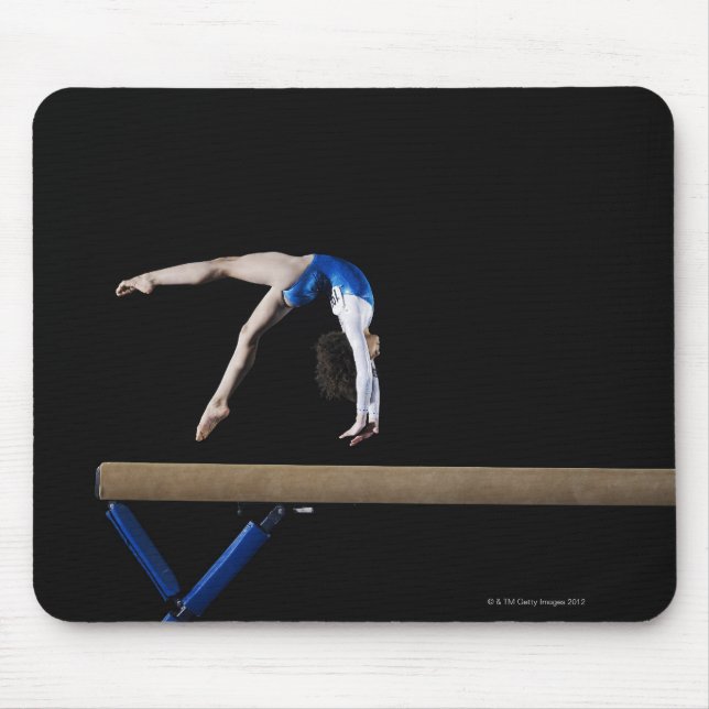 Gymnast (9-10) flipping on balance beam, side mouse pad (Front)