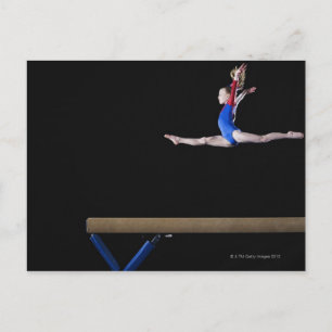 Gymnast (9-10) leaping on balance beam 2 postcard
