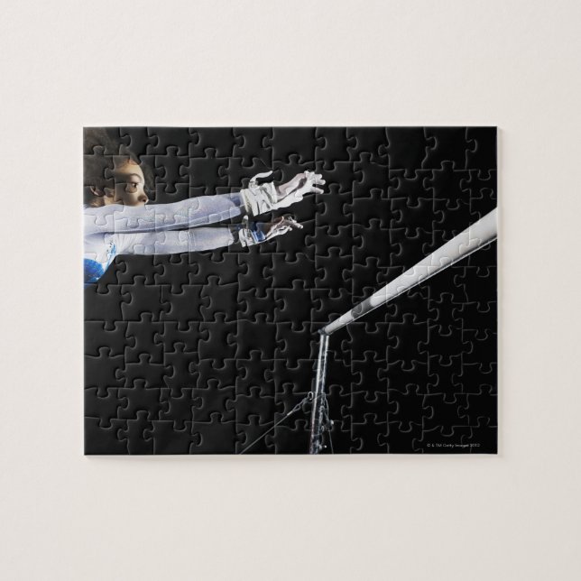 Gymnast (9-10) reaching for uneven bars 2 jigsaw puzzle (Horizontal)